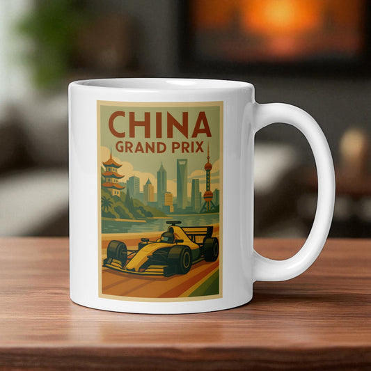 White mug with China Grand Prix design featuring a race car and cityscape on a wooden surface.